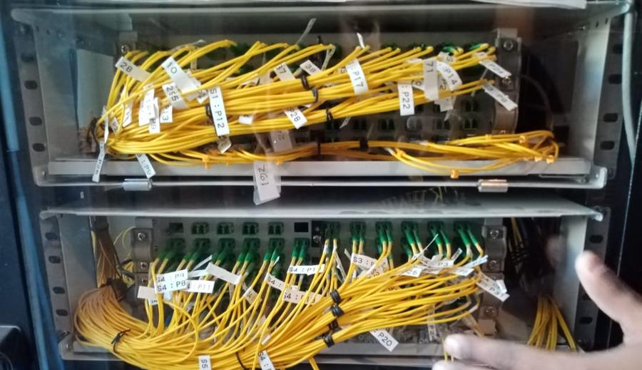 Fiber optic distribution frame with labelled single-mode patch cords installed by Waves