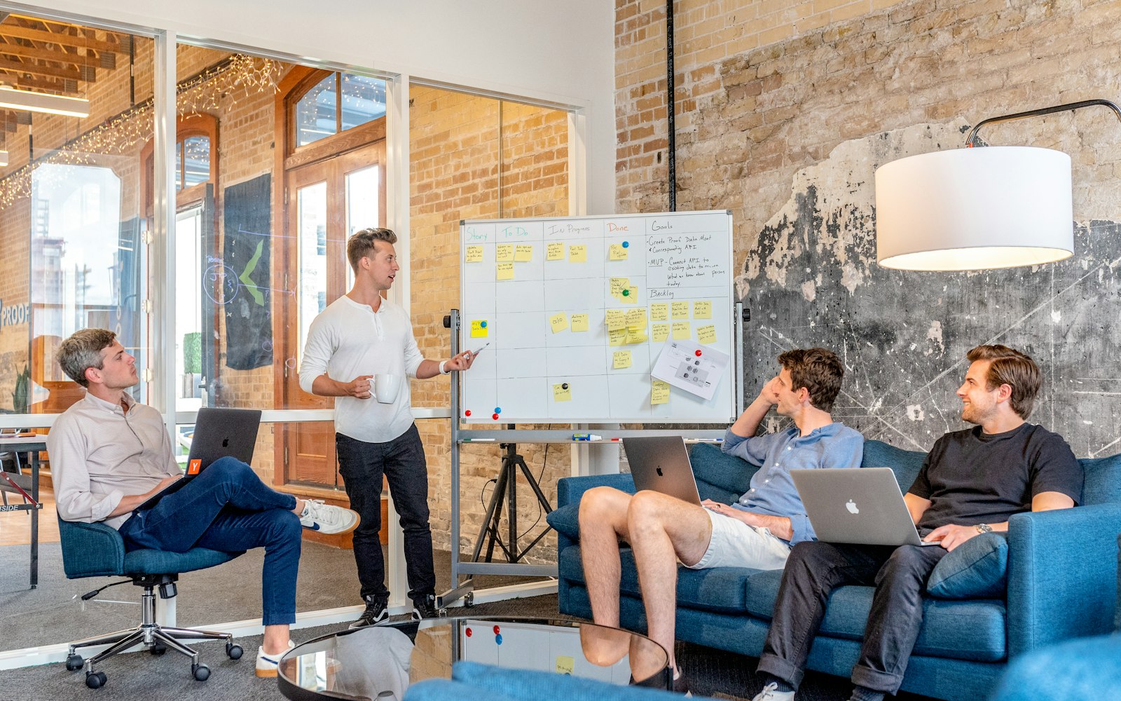 Team workshop at a whiteboard agreeing an AI use policy