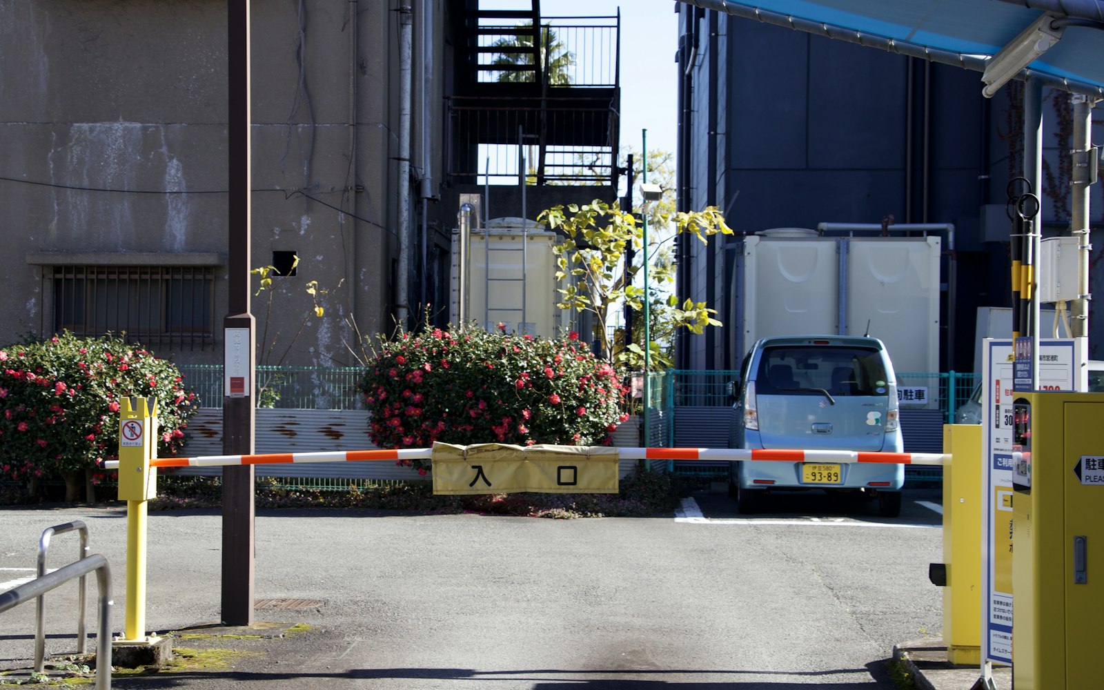 Vehicle waiting at a closed barrier gate