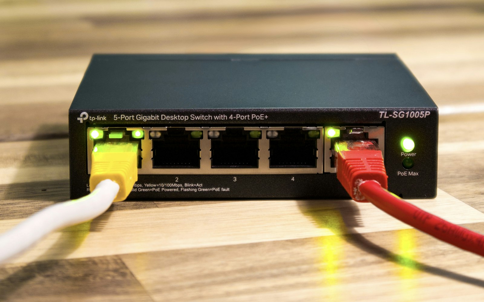 Network switch with Ethernet cables connected in a company rack