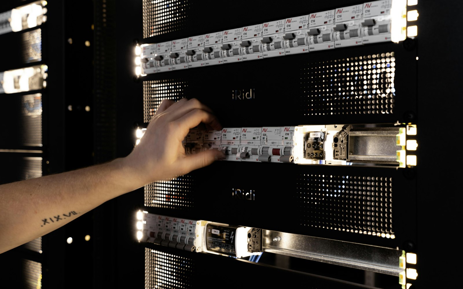 IT engineer adjusting equipment in a server rack