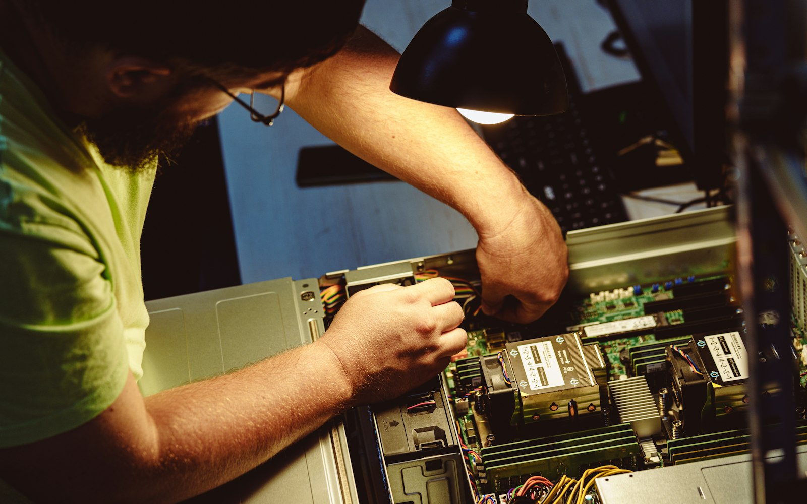 Engineer working on servers during backup recovery
