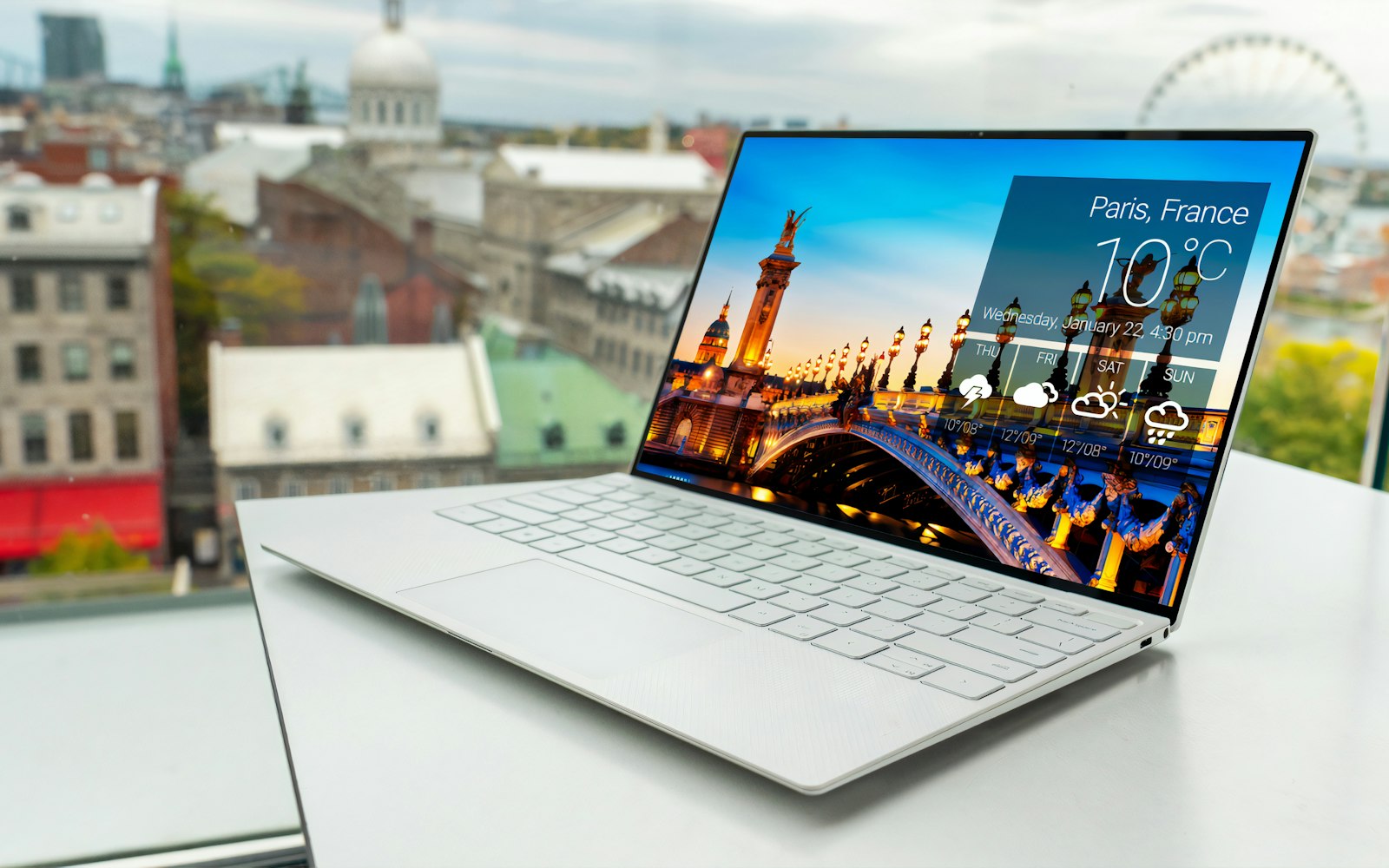 Business laptop on a white desk ready for staff handover