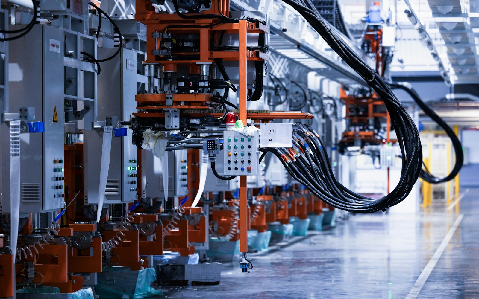 Electrical control cabinets lined up inside a factory