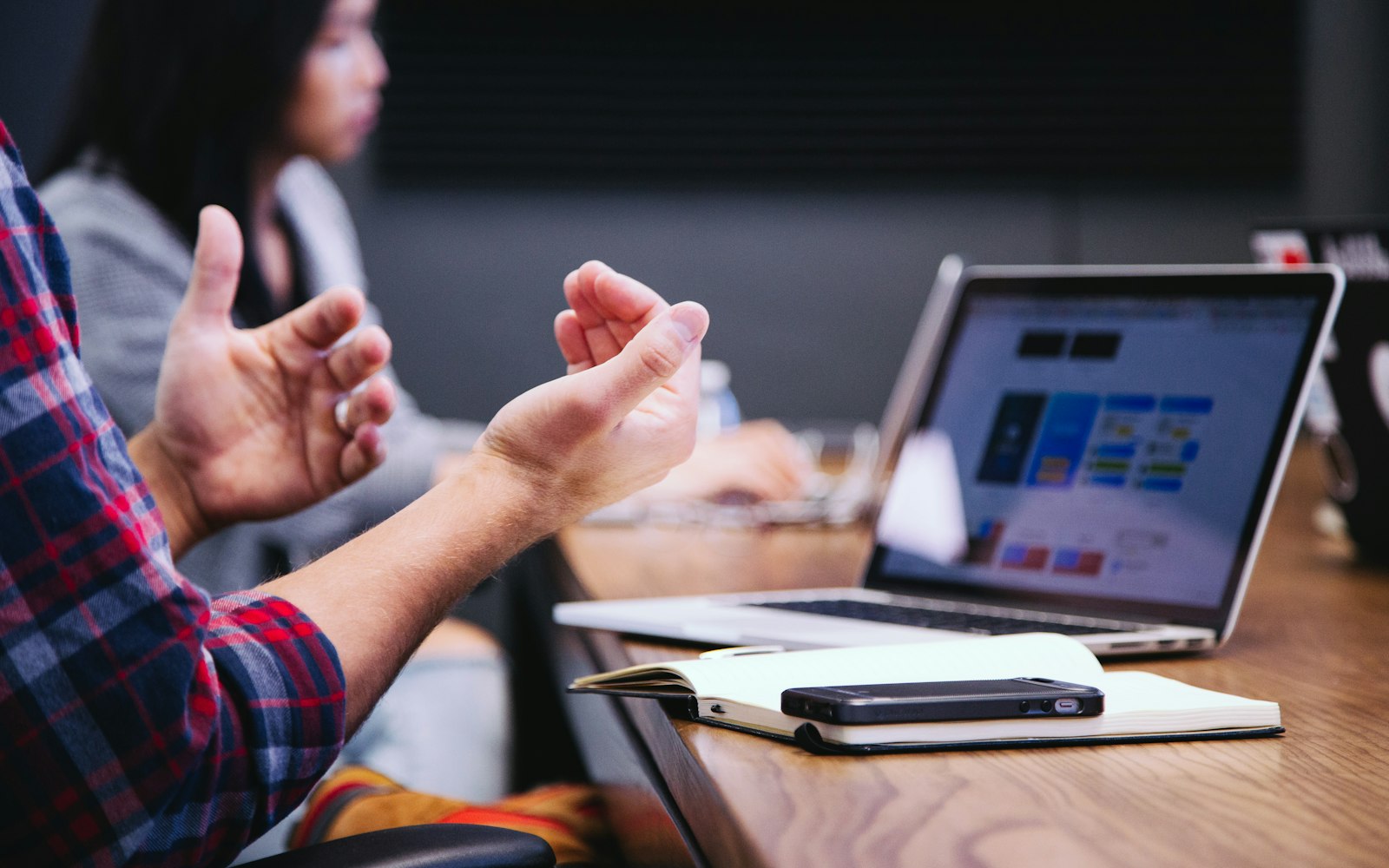 IT security consultant discussing findings with a client in a meeting room