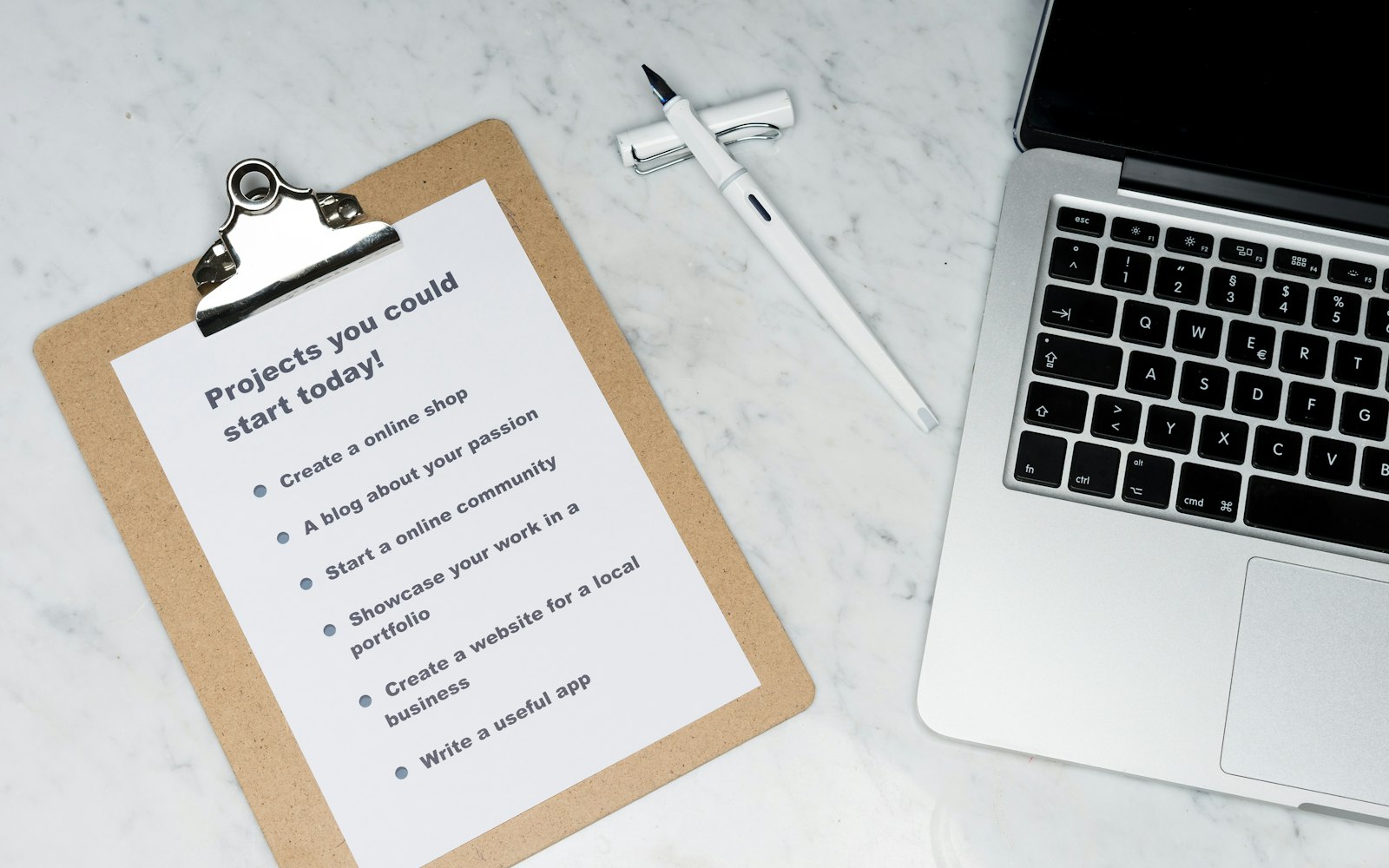 Compliance checklist printout beside a laptop